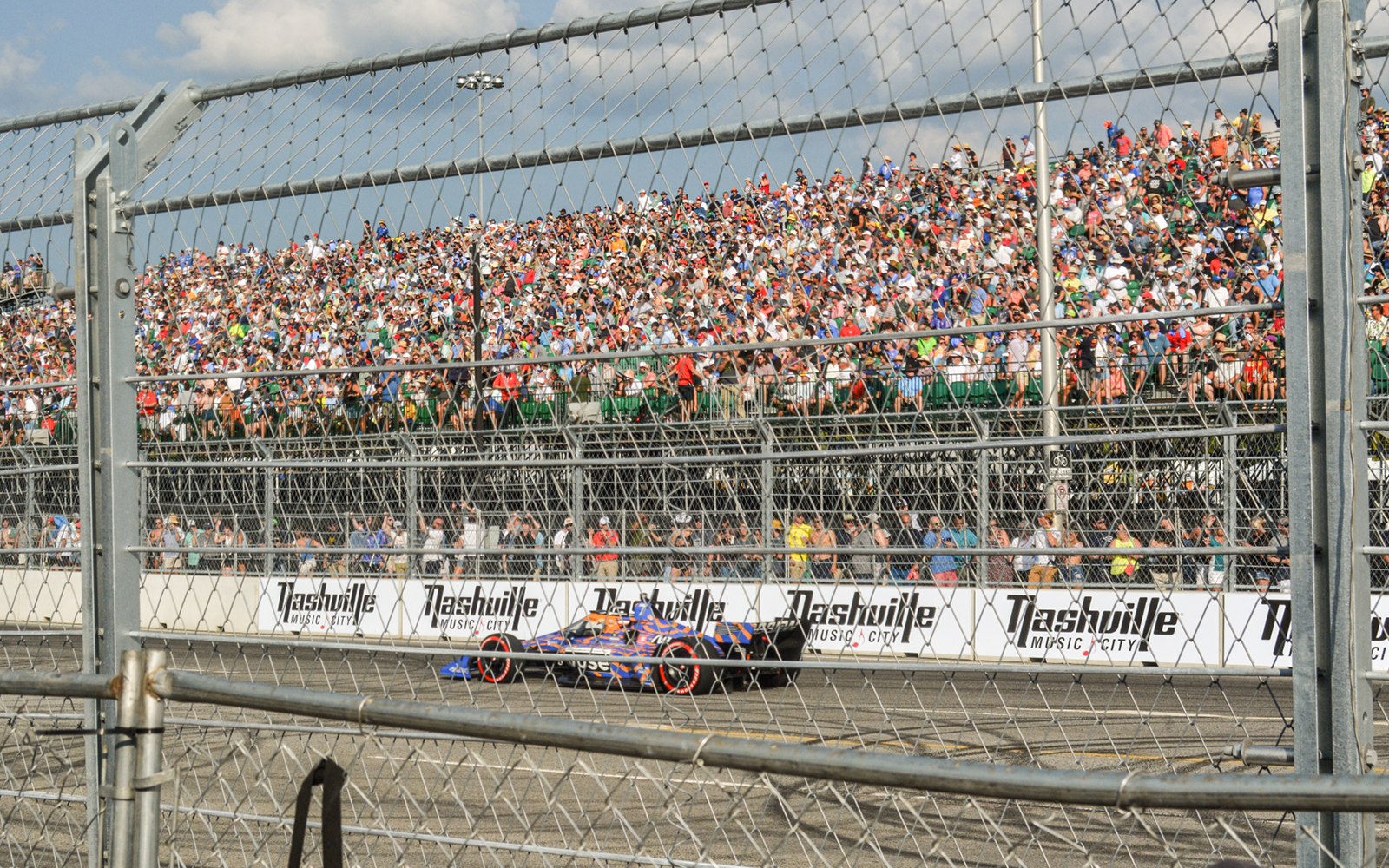 grandstands packed with people watching the main event: the Big Machine Music City Grand Prix